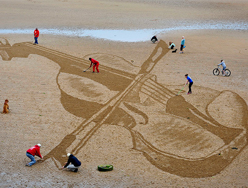 The giant violin lasted for just a few hours before it was washed away by the tide. Picture by Colin Hattersley