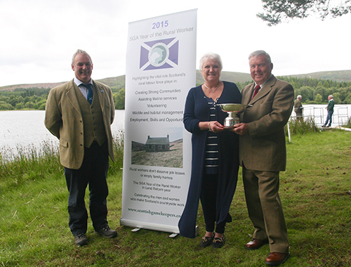 Scottish Gamekeepers Association Chairman Alex Hogg (left) with the recipients of the first Ronnie Rose Award for Conservation, Iris MacKenzie and John Waters.