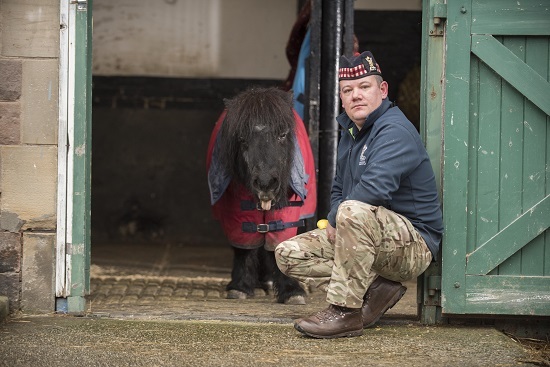 Cruachan III with Corporal Mark Wilkinson, the Royal Regiment of Scotland's pony major