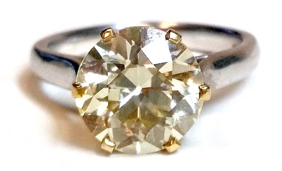An impressive certificated yellow diamond solitaire ring