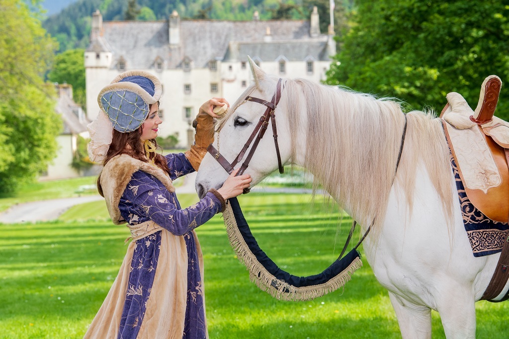 Pluto with Lady Bethany Martin in front of beautiful Traquair House

(Photo: Ian Georgeson Photography)