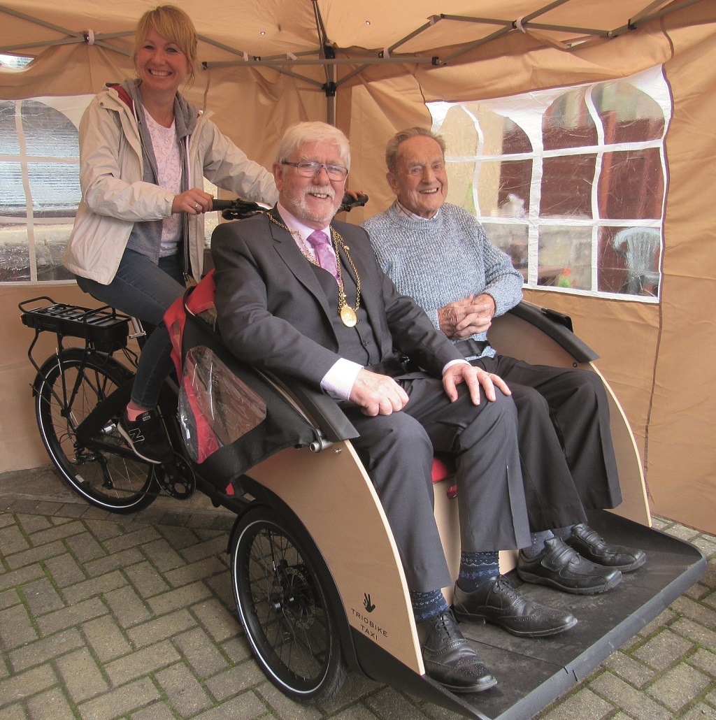Pensioners are enjoingy the companionship in trishaws