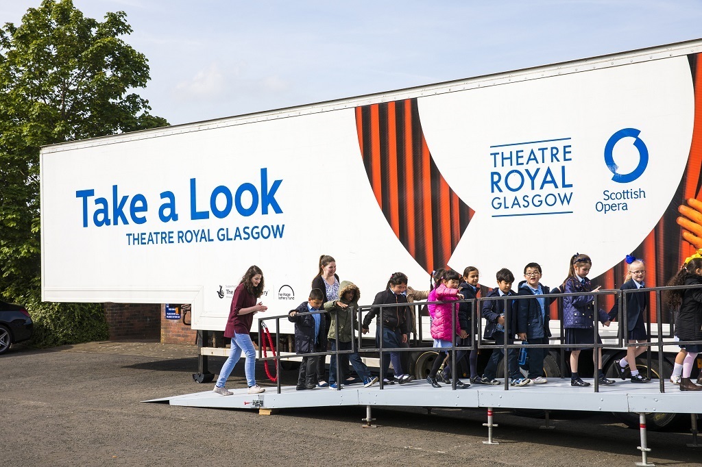 Children arriving at the Pop-up Opera travelling opera house last summer (Photo:  James Glossop)