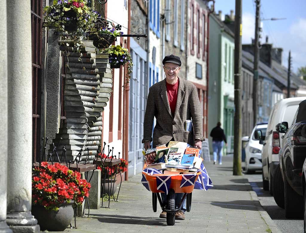 Barrow loads of book fun with Andrew Wilson, owner of the Beltie Books bookshop in the town (Photo: Colin Hattersley)