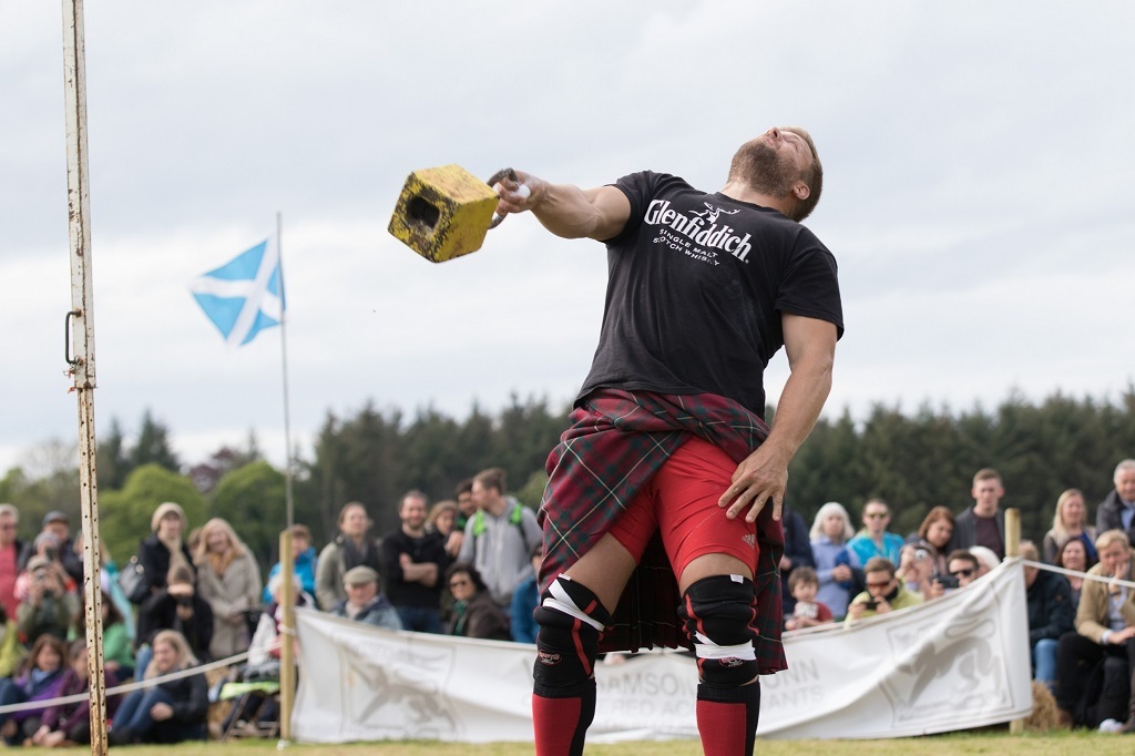 Heavy eventer Scott Rider competes in Weight Over The Bar at the 2017 Gordon Castle Highland Games
