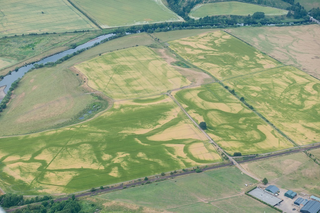 The straight lines of the Roman temporary camp in Stratheran stand out against patterns of ancient water courses