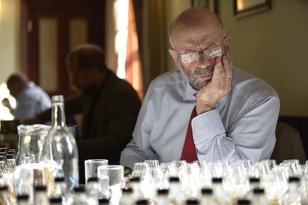 Judge Vince Fusaro contemplates his whiskies