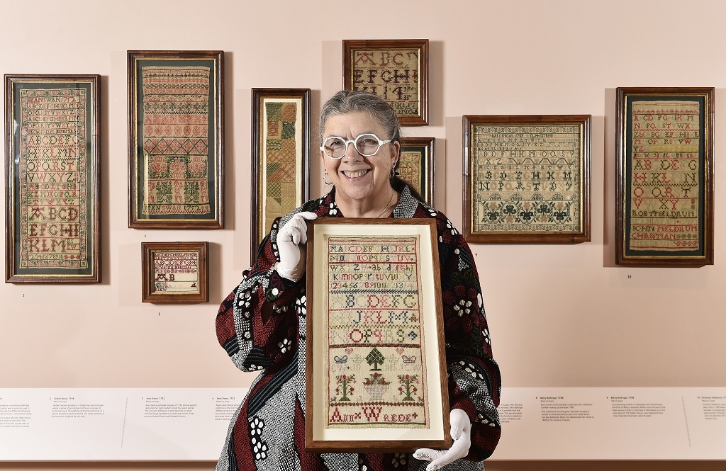 Leslie B Durst with Greenock's  Ann Wrede's sampler dating from c1846 (Photo: Neil Hanna Photography)
