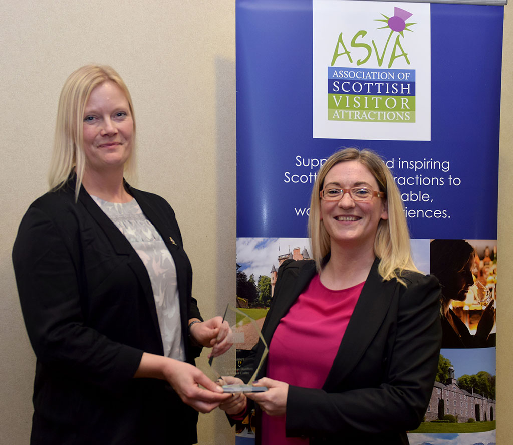 Tamsin Job, The Royal Yacht Britannia, presents the 2018 ASVA Best Visitor Experience Award to Jaclyn McKie, Isle of Arran Distillery and Visitor Centre