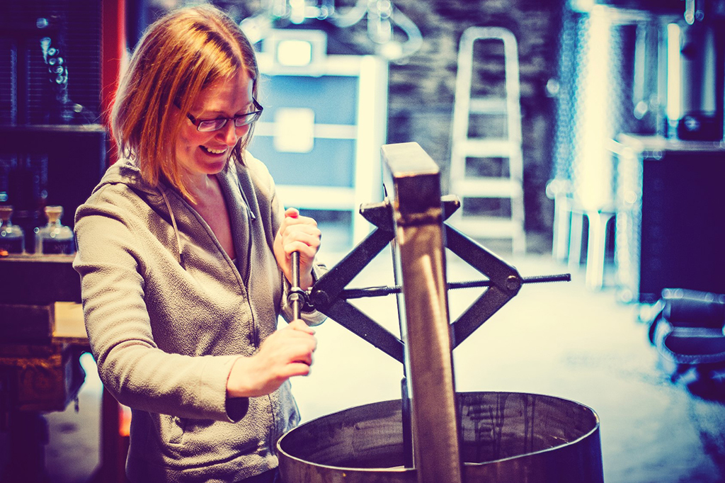 Katie Sime operating the apple press