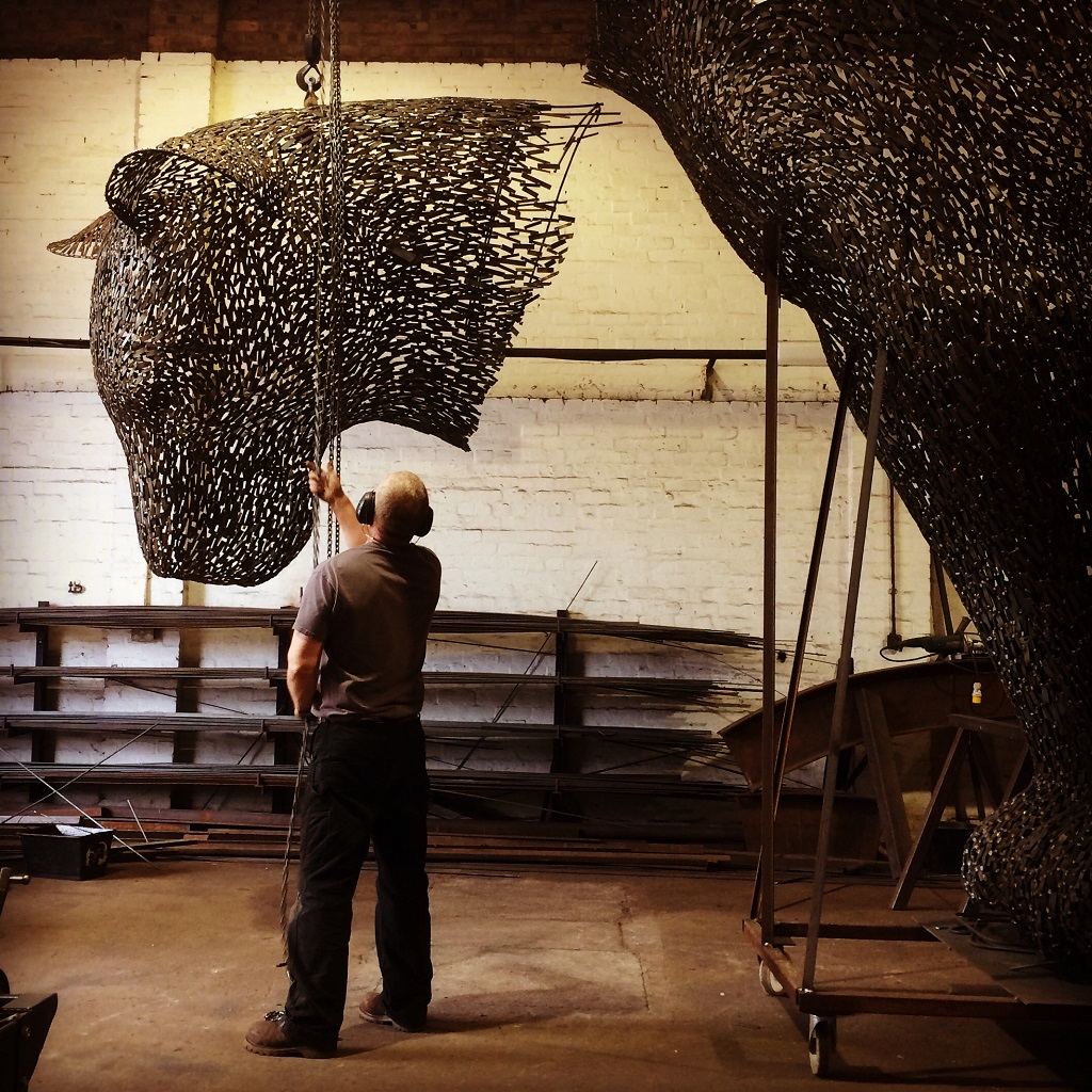 Andy Scott at work on 'Poised' in his studio 