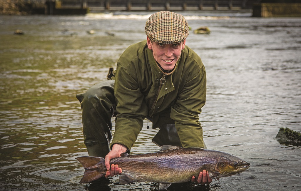 Proof that the
change in tactics worked: the 14lb salmon before its release back into the river.