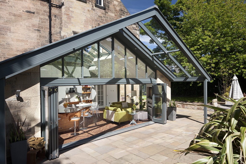 A beautiful kitchen extension with glass canopy from Mozolowski and Murray