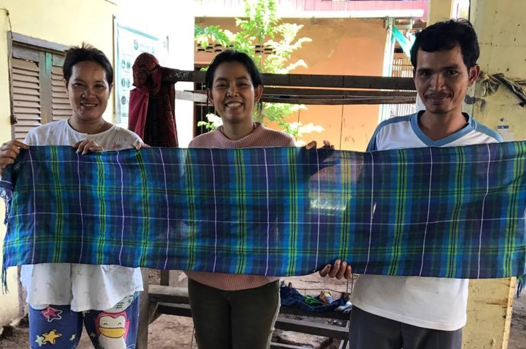 Anak with weavers in Cambodia