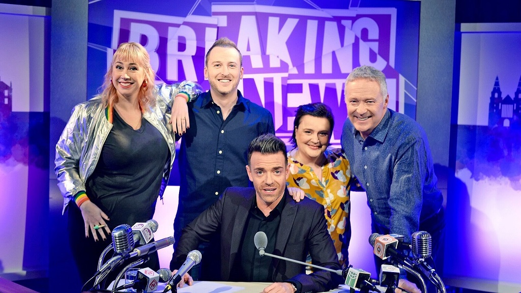 Des (seated) hosts BBC Scotland topical quiz show Breaking the News