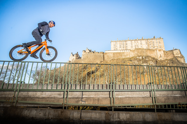 Danny MacAskill performs a stunt near Edinburgh Castle