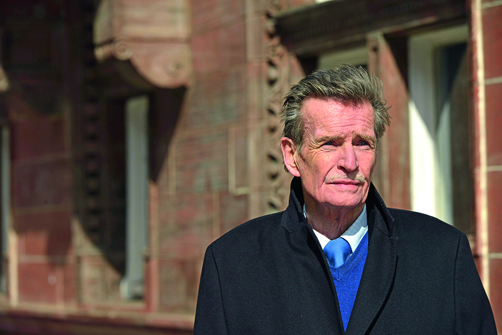 William McIlvanney on the street of Glasgow.