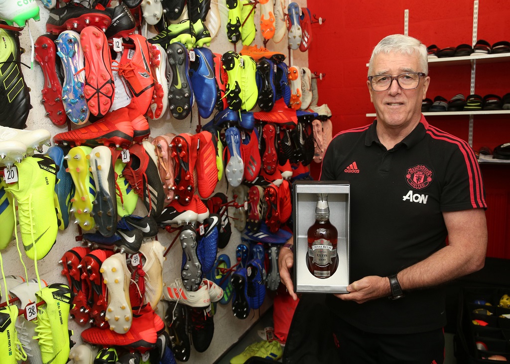 Manchester United club ambassador and former kit man, Albert Morgan, is pictured with a bottle of Chivas Ultis 1999 Victory Edition (Photo:  Manchester United Football Club)