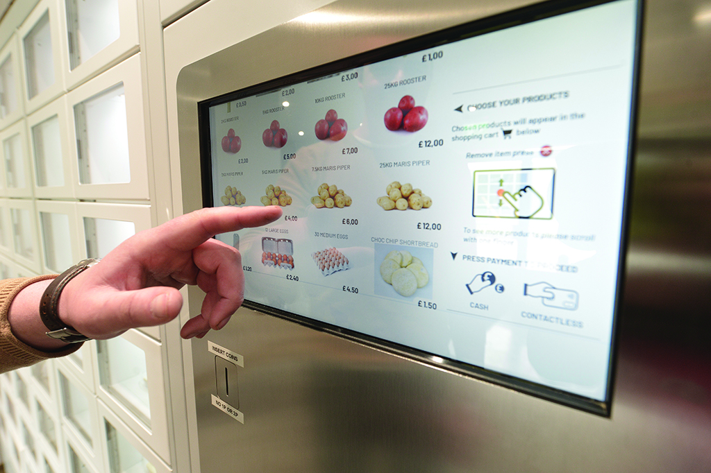 Selecting fresh vegetables from the vending machine (Photo: Angus Blackburn)