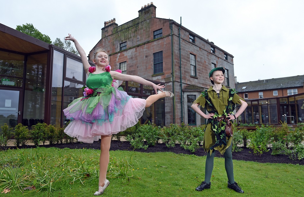 Dreams Can Come True Ð Joanna
Lumley Celebrates Moat Brae Opening
Cabinet Secretary Fiona Hyslop applauds agencies, charities and community for giving a new future to the house that inspired Peter Pan
The opening of Moat Brae, the house and garden where Peter Pan began, was celebrated
with a colourful garden party hosted the trustees of the Peter Pan Moat Brae Trust (PPMBT)
along with Patron Joanna Lumley.
Among the guests at Friday afternoonÕs event, which was held to thank supporters and
funders and welcome future partners, was Scottish Government Cabinet Secretary for
Culture and Tourism Fiona Hyslop MSP.
Saved from demolition 10 years ago the beautiful Georgian property overlooking the river
Nith, in Dumfries, has been restored and transformed into ScotlandÕs new National Centre
for Storytelling and ChildrenÕs Literature.


Pic caption: Peter Pan and  Tinkerbell played by  Morvin Terrace and  Jorja Lindsay aged 14 from Dumfries Academy at the official opening