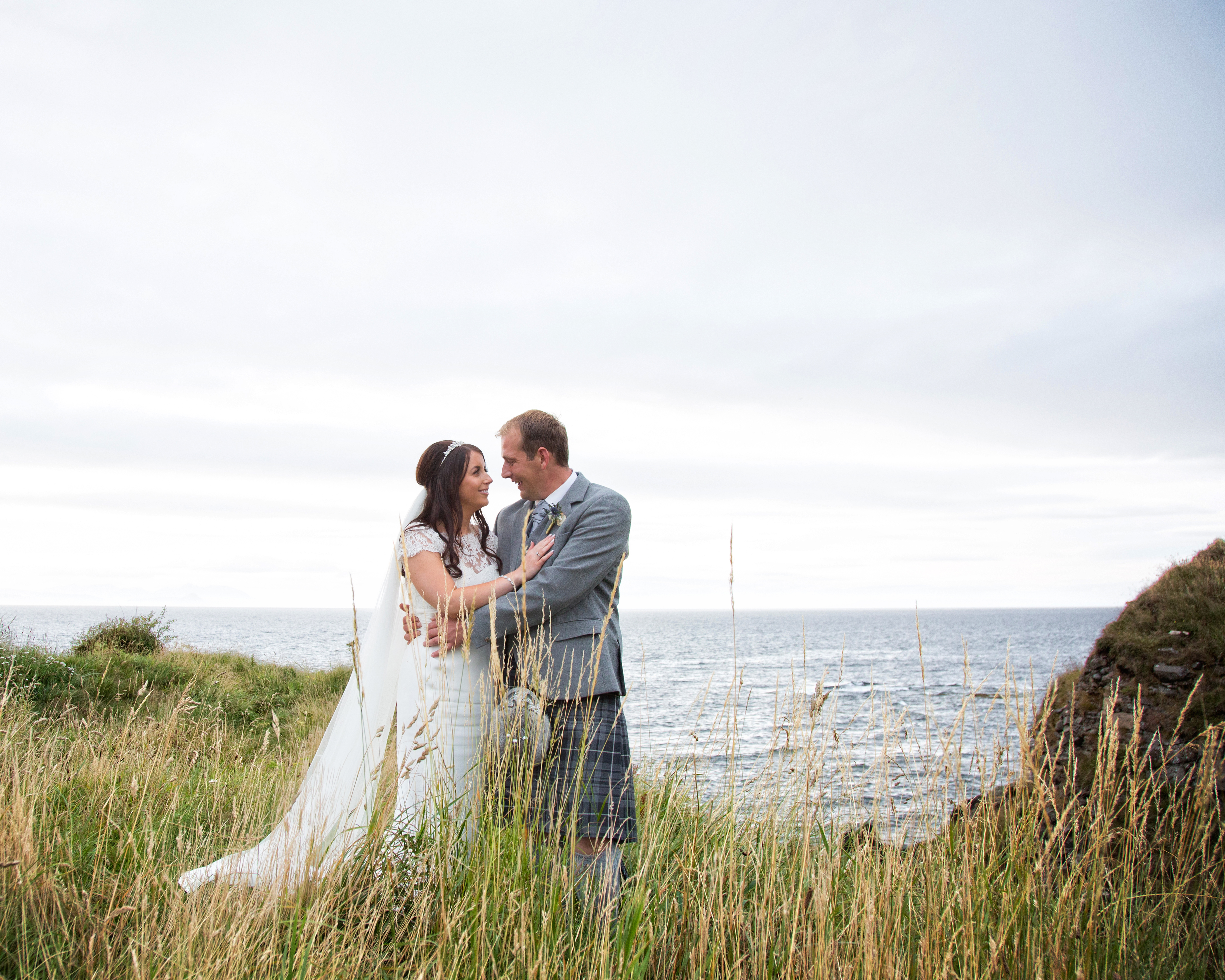 A delighted couple celebrate their marriage in the ground of Trump Turnberry