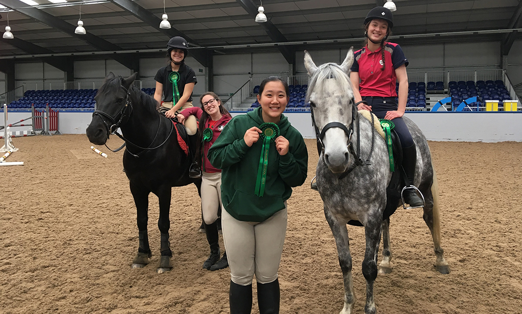 SRUC equine summer school students show off their rosettes