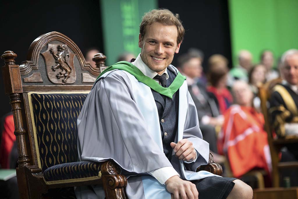 Outlander star and scots actor Sam Heughan receiving his honarary doctorate from Chancellor Jack McConnell at University of Stirling 27/6/19