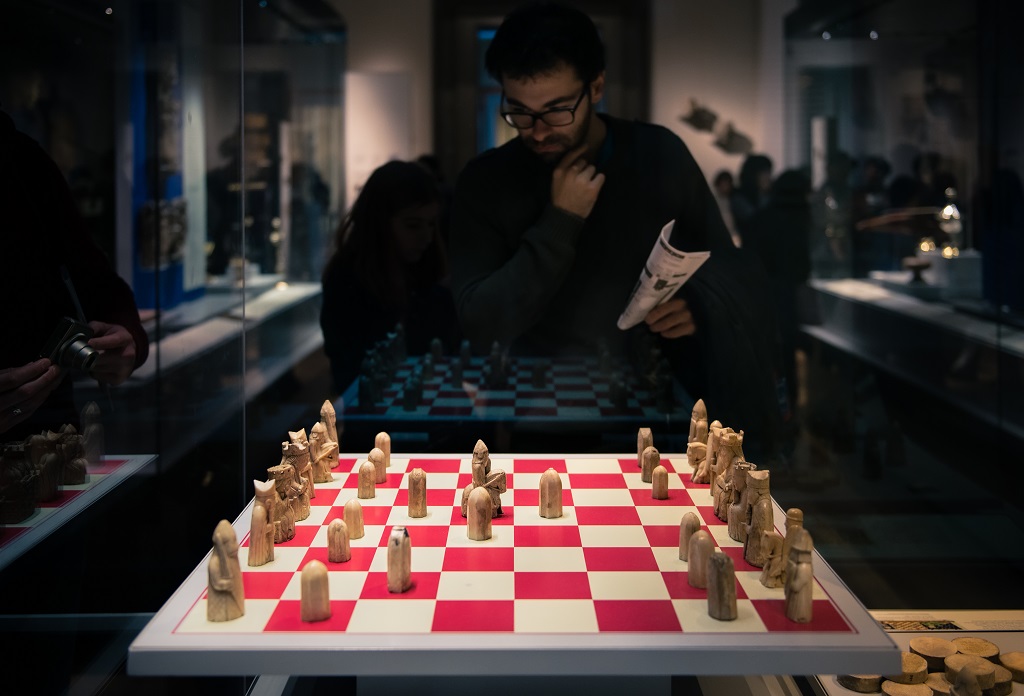 A visitor looking at the Lewis chessmen at the British Museum