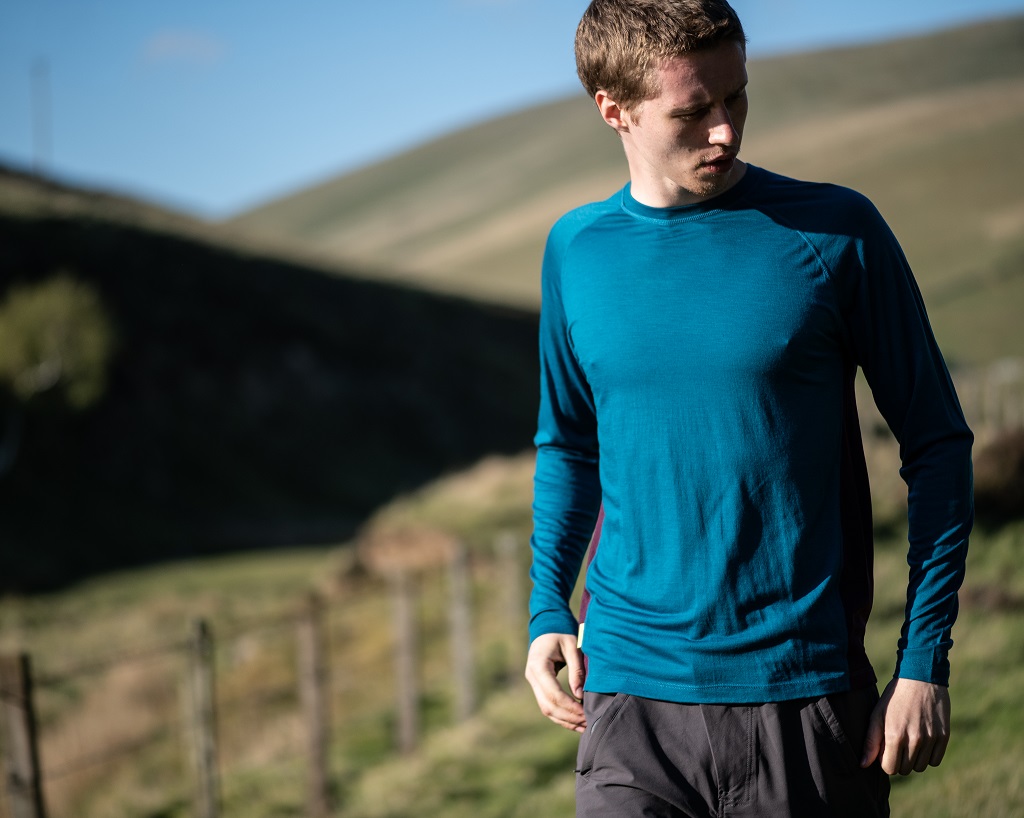 The FINDRA merino lite long sleeve top in loch blue 