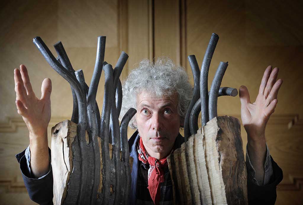 Artist Charlie Poulsen and one of his sculptures in Marchmont House.
(Photo: Colin Hattersley)