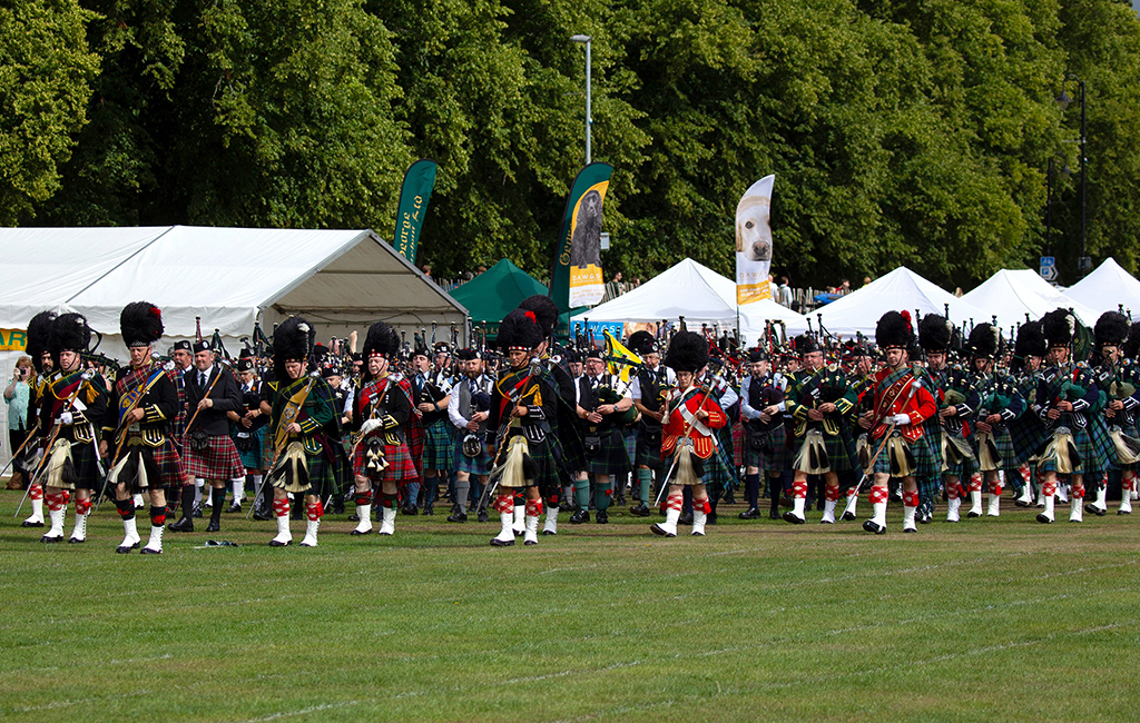 Massed pipe bands at the Aboyne Highland Games