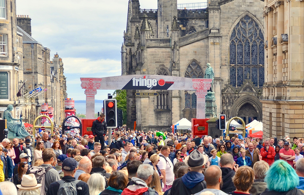 Crowds of tourists on the Royal Mile for the Edinburgh annual Fringe Festival (Photo: Lou Armor/Shutterstock)