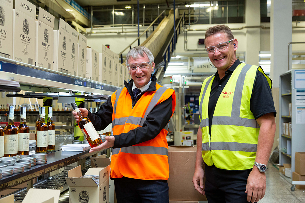 Trade Minister Ivan McKee with Gavin Brogan, operations director at Diageo Leven