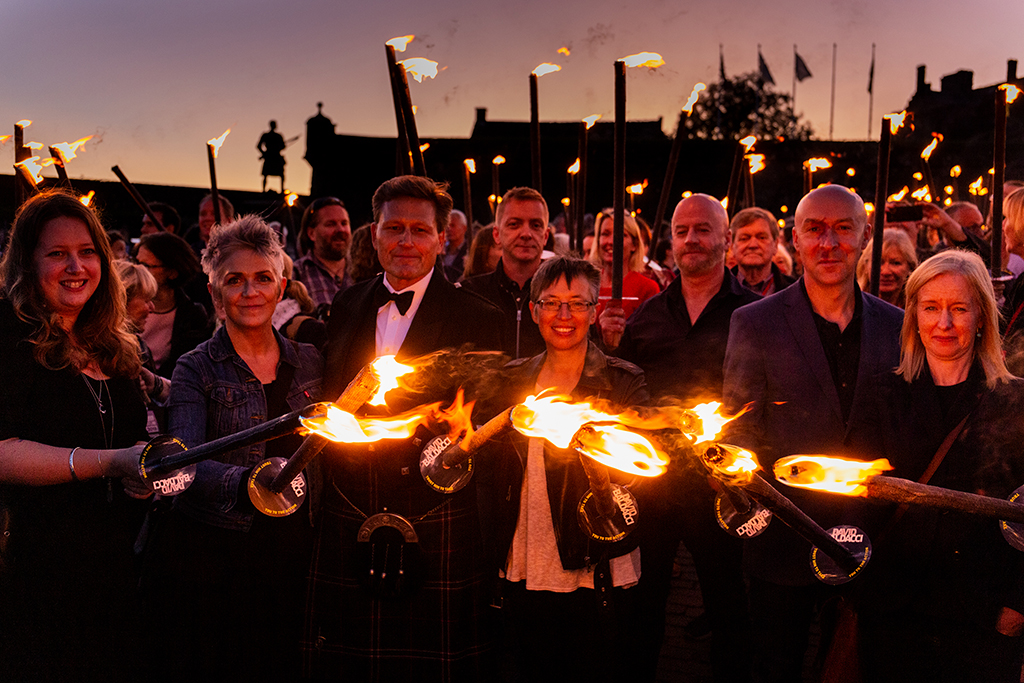 (L-R) Claire Askew, Denise Mina, David Baldacci, Doug Johnstone, Manda Scott, Craig Robertson and Ambrose Parry (Chris Brookmyre and Marisa Haetzman) photographed at the torchlit procession at Stirling Castle for Bloody Scotland(Photo: Paul Reich)