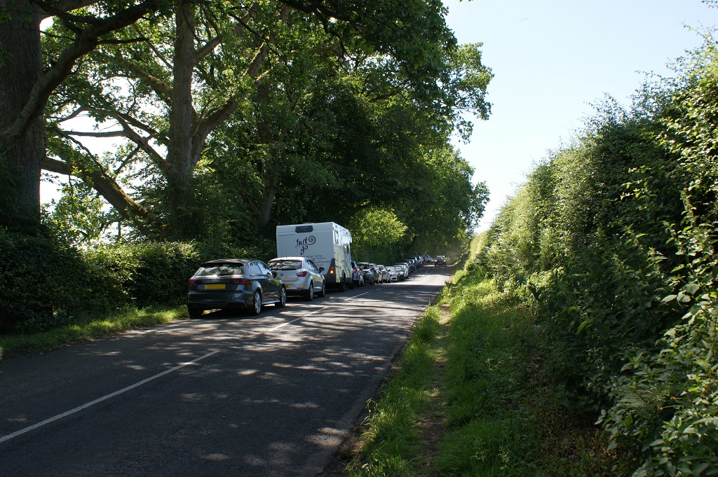 Vehicles on the road near the Devil's Pulpit
