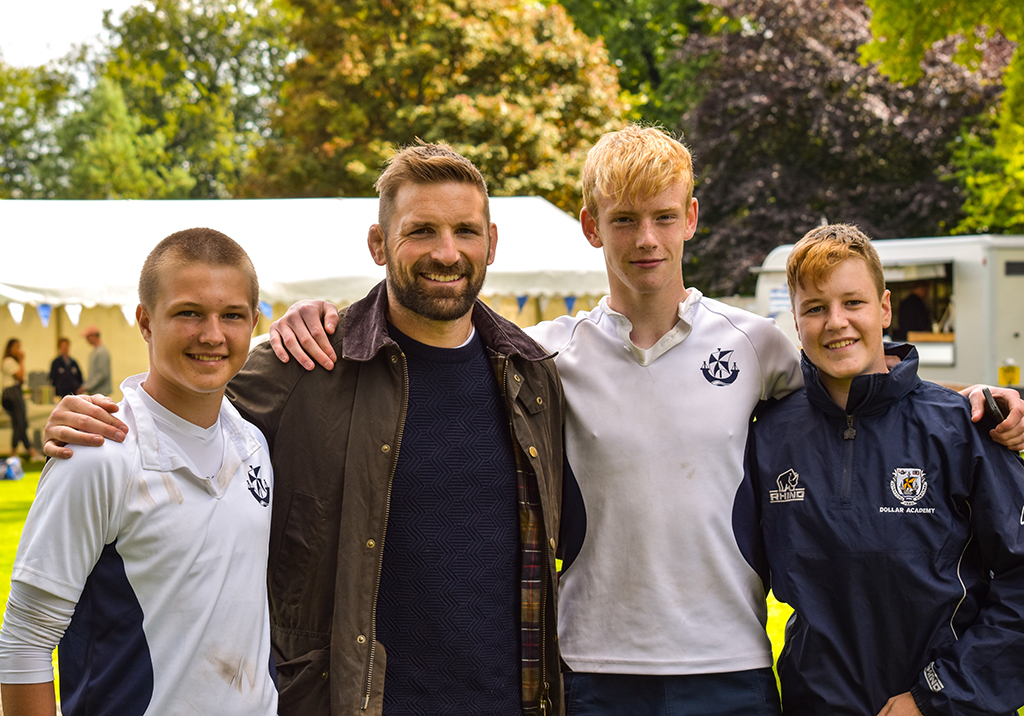 Former pupil and Scotland rugby player John Barclay with some of the Dollar rugby team