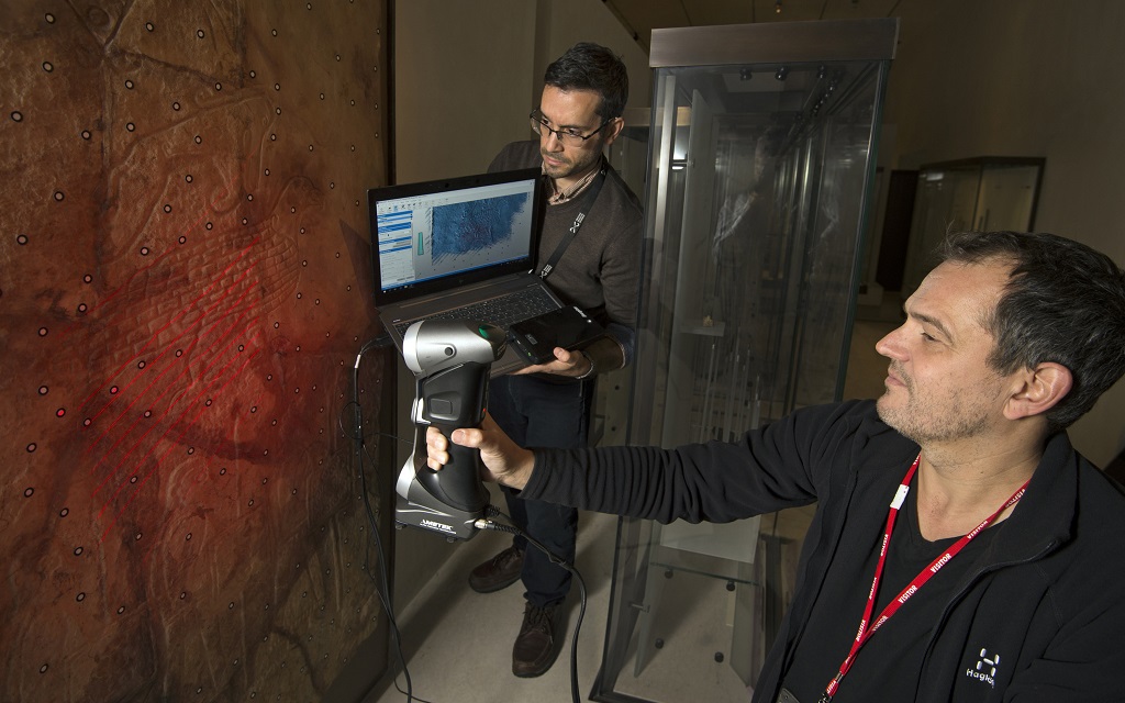 Dr Adrián Maldonado, Glenmorangie Research Fellow, National Museums Scotland and Henrik Zedig ,Länsstyrelsen Västra Götaland, Sweden study a carved stone from the Brough of Birsay on Orkney. (Photo: Neil Hanna)