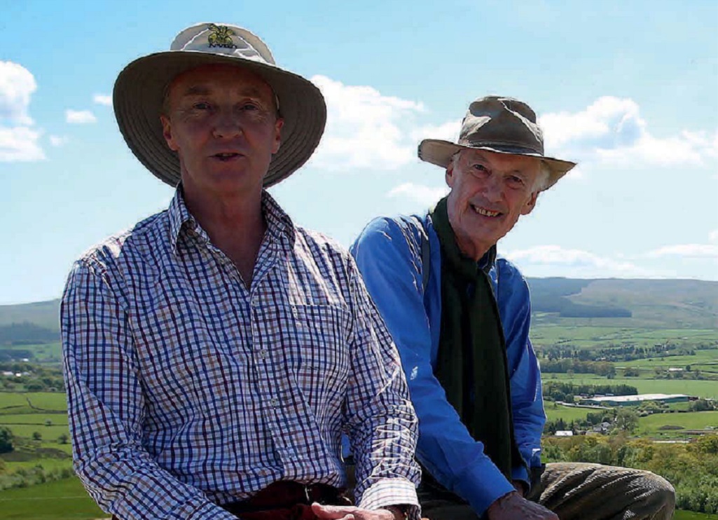 Friends for more than 30 years, the Duke of Buccleuch and renowned
landscape architect Charles Jencks enjoy the view from the Belvedere, which offers a 360-degree view of the surrounding countryside (Photo: Ian MacNicol)