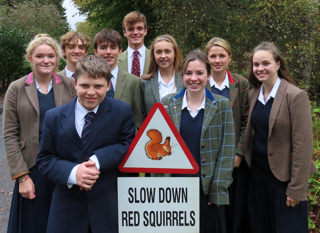 Some of the Glenalmond College pupils who took part in the survey are pictured with one of the school’s road signs warning drivers to be aware of the school’s red squirrel population