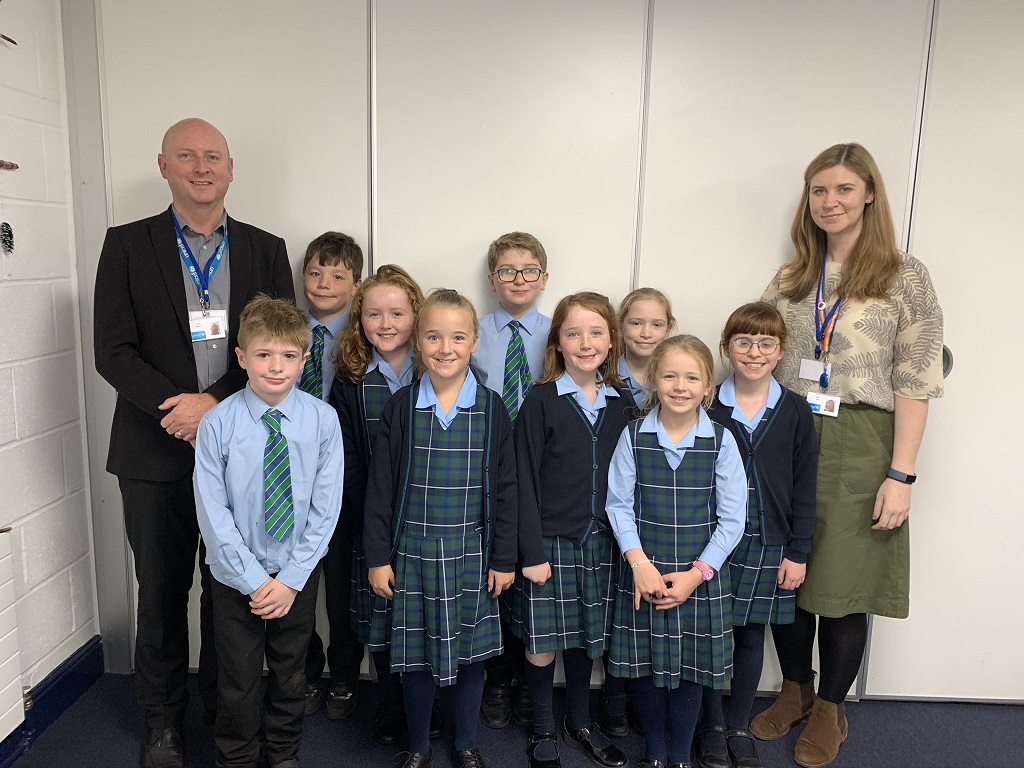P5 Lomond pupils with their diffusion tube outside the school, and another of the pupils with Gerrie McMurtrie, UNICEF senior professional advisor for Rights Respecting Schools, and Jessica Bool, UNICEF youth Strategy Lead