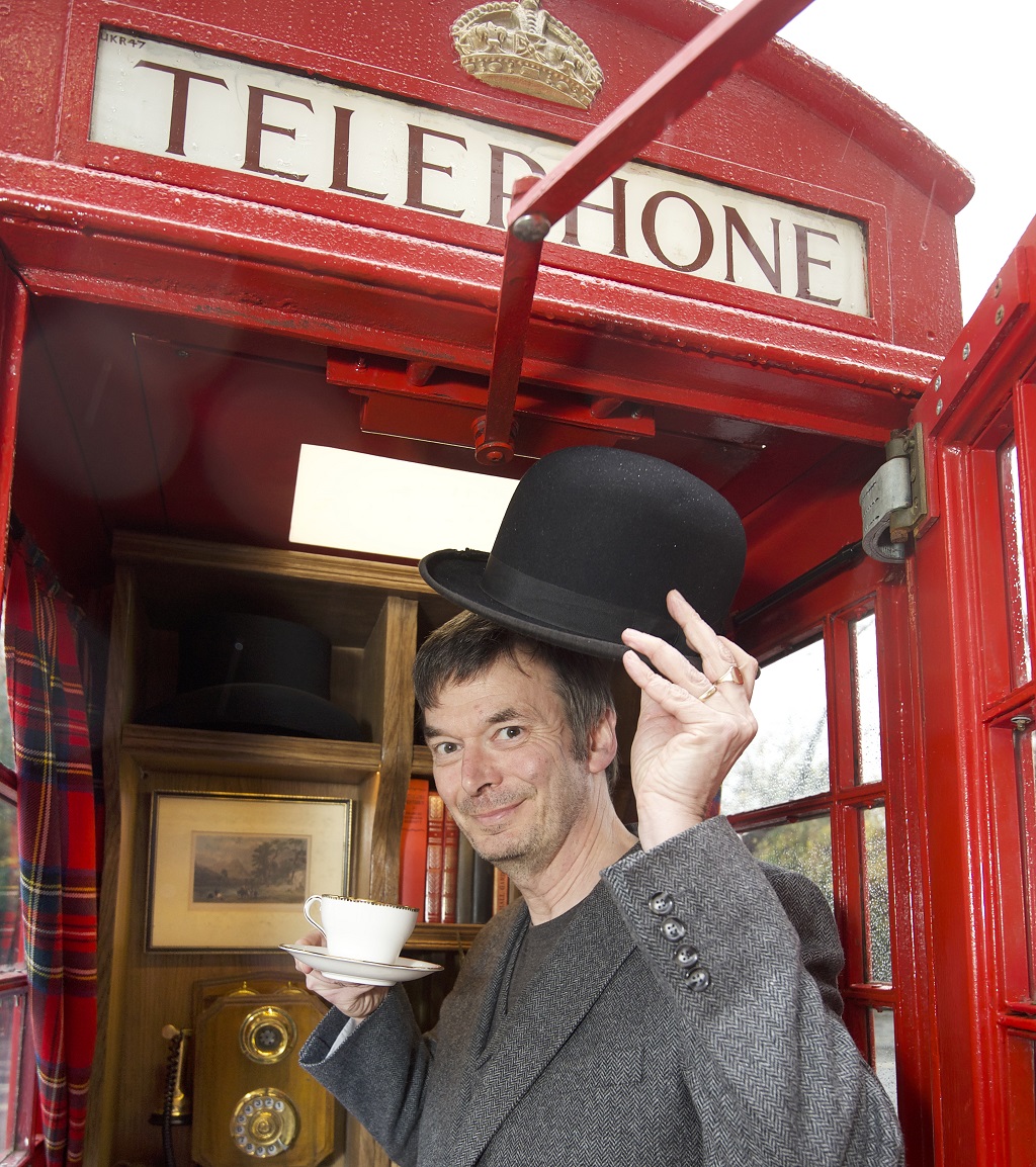 Ian Rankin with Save the Children's rescued phone box Gilbert on Queen Street, Edinburgh (Photo: Sandy Young )
