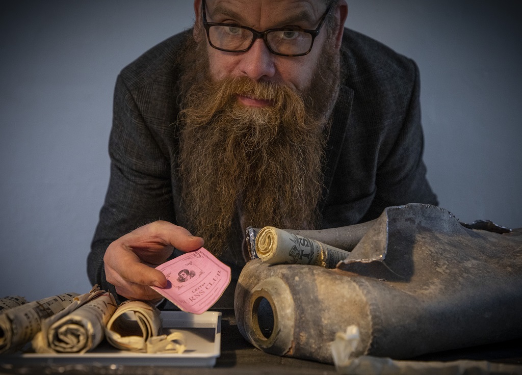 Conservator Nic Boyes displays the findings