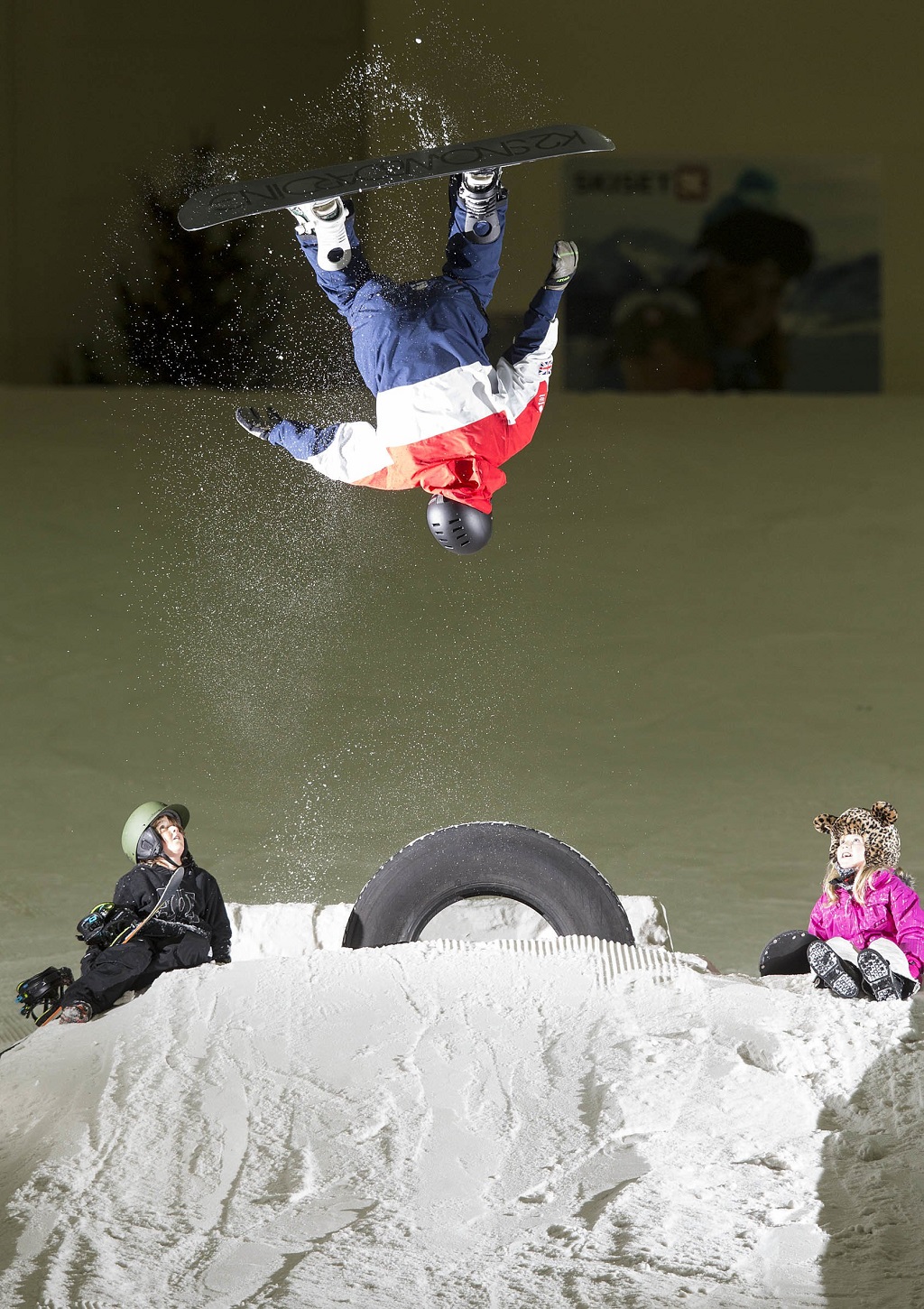 Kids enjoy the snow as former World Cup snowboarder Ben Kilner somersaults at Snow Factor (Photo: Jeff Holmes)