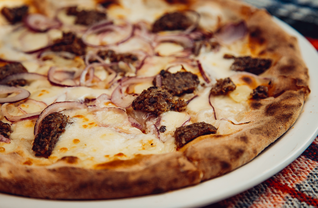 La Favorita's pizza with haggis, red onions, sliced potatoes, super creamy mozzarella and a drizzle of whisky to complete the meal
