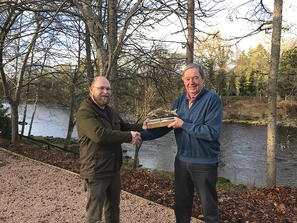 David Littlewood (left) of Banchory’s Tor Na Coille Hotel, presents the trophy to Lawrence Ross, chairman of the Dee Board