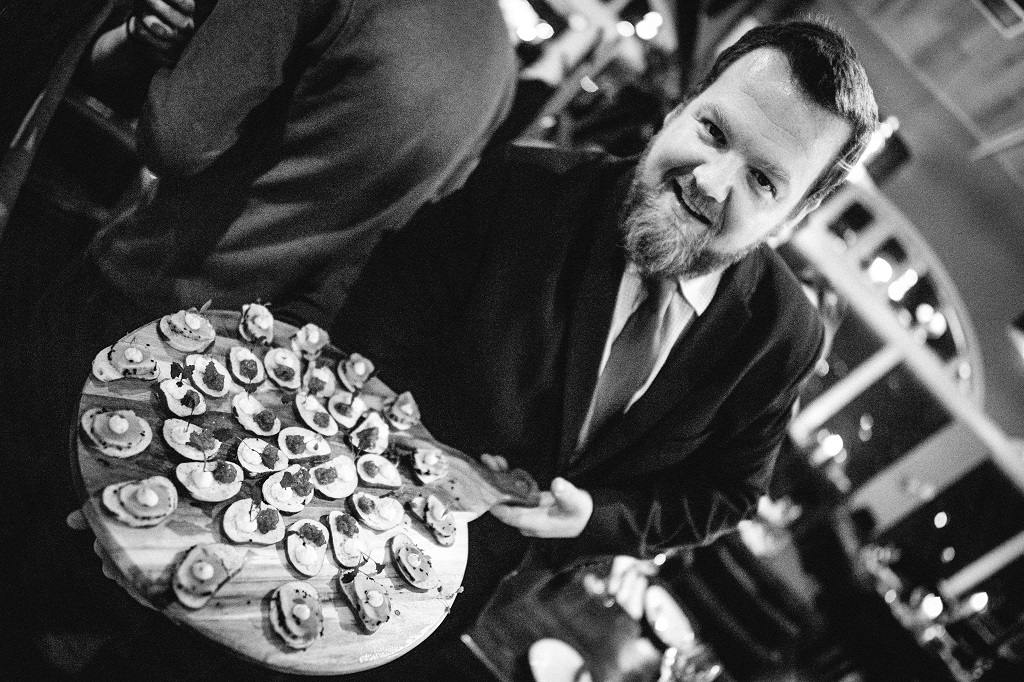 Mark Patonyi serving canapes