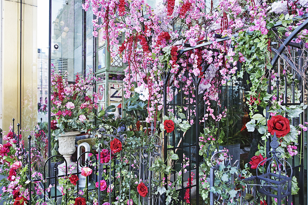 The Ivy on the Square's entrance is an explosion of red and pink roses.