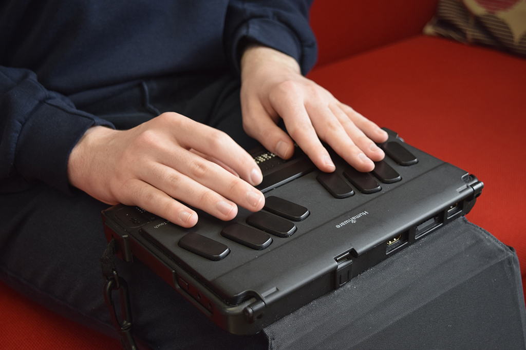 Andrew types with a braille keyboard at the Royal Blind School (Picture: Royal Blind).