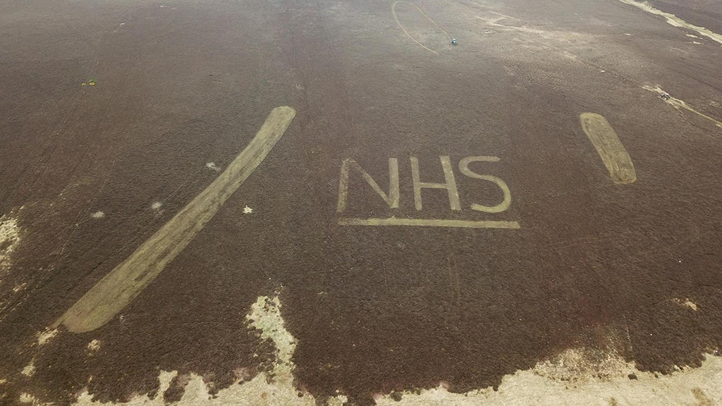 How the letters look from above, with the gamekeepers’ tractors in the background (Picture: SUMG).