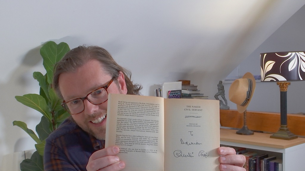 Damian Barr with his signed copy  of Quentin Crisp's work